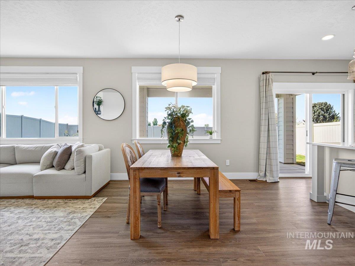 1811 Rome Avenue Emmett, ID 83617 - Photo 11 of 50 Open-concept living area featuring wood-finish flooring throughout