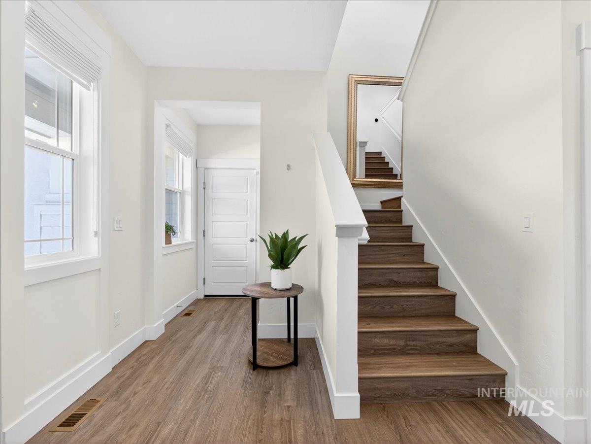 1811 Rome Avenue Emmett, ID 83617 - Photo 20 of 50 Entryway featuring wood-finish flooring, white baseboards, and a paneled entry door