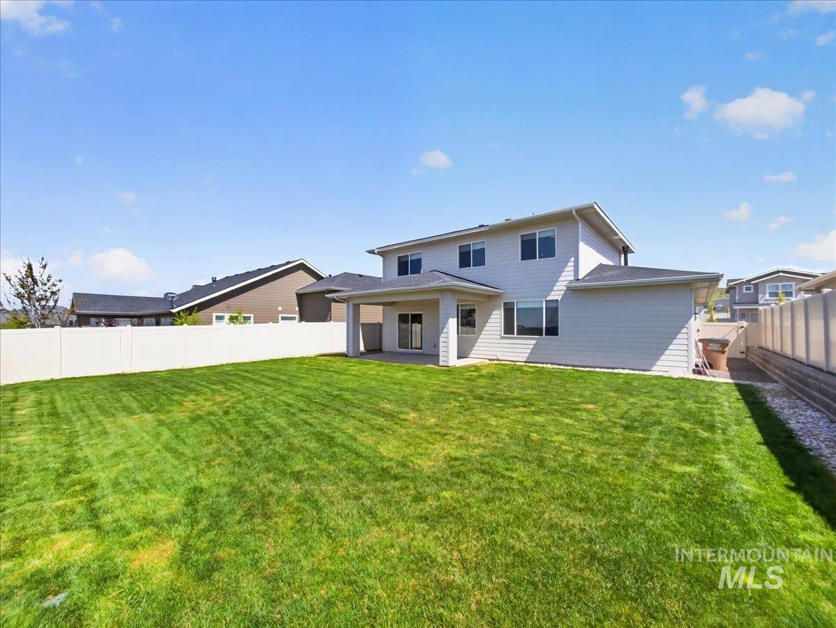 1811 Rome Avenue Emmett, ID 83617 - Photo 44 of 50 Expansive green lawn with a white privacy fence