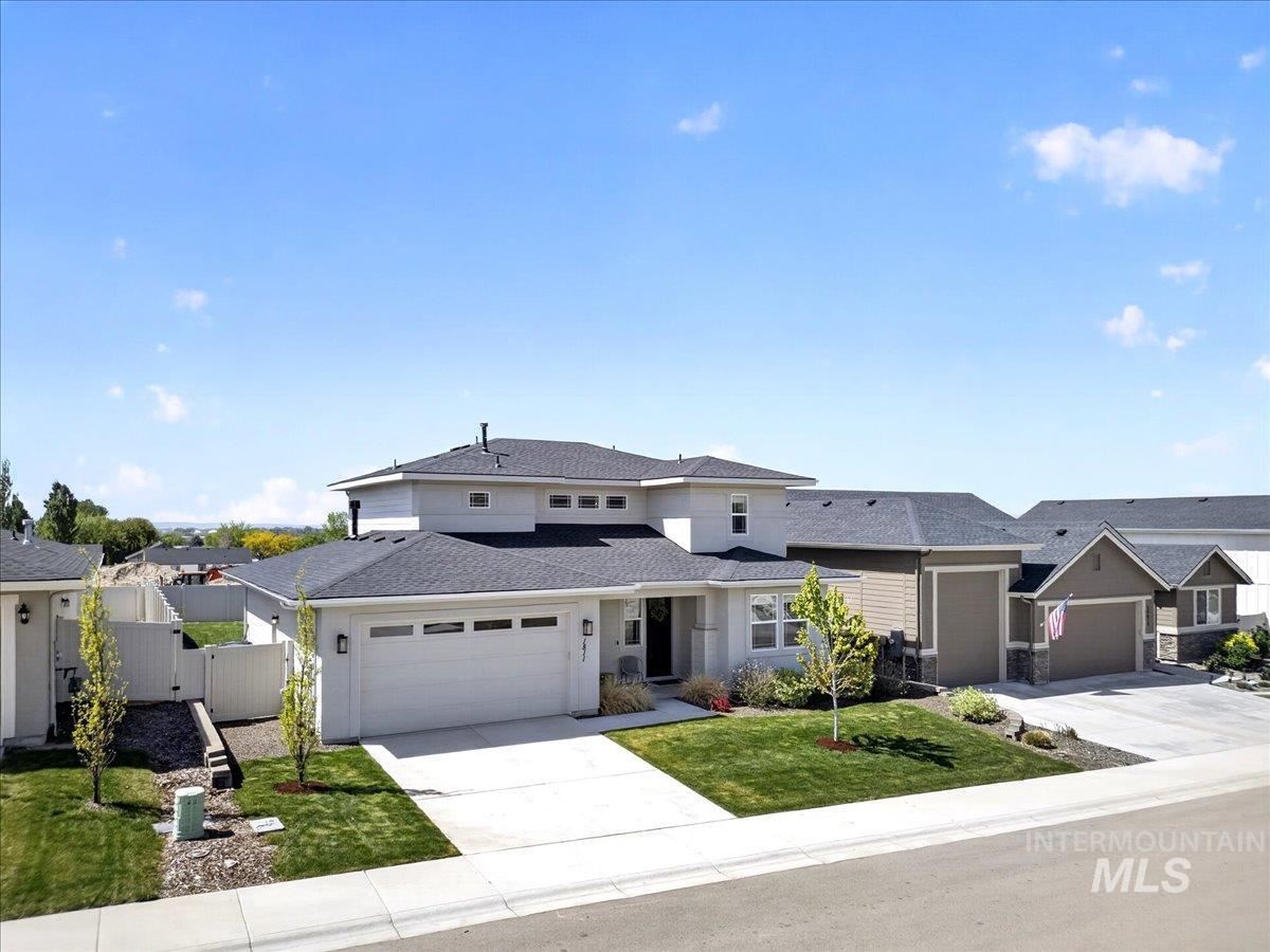 1811 Rome Avenue Emmett, ID 83617 - Photo 5 of 50 Contemporary residence featuring a light-colored exterior with dark shingle roofing