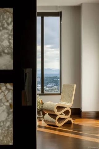 a view of a room with window and wooden floor