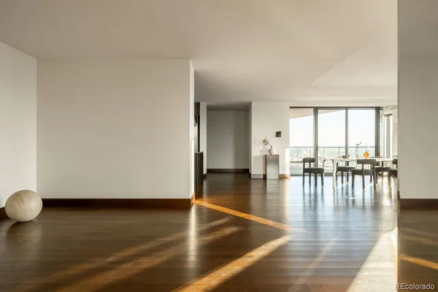 a kitchen with stainless steel appliances granite countertop a refrigerator a sink and a stove