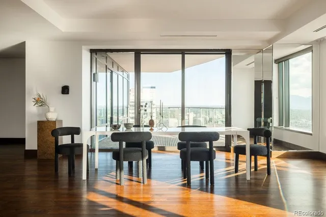 a view of a dining room with furniture window and wooden floor