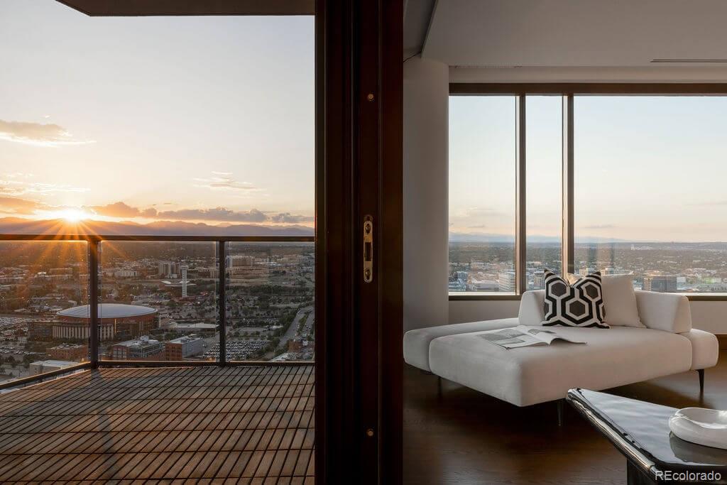 1133 14th Street, Unit 3700 Denver, CO 80202 - Photo 3 of 48 a view of a living room with furniture and floor to ceiling window