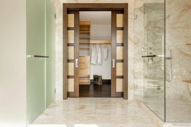 a view of a bathroom with a tub and shower