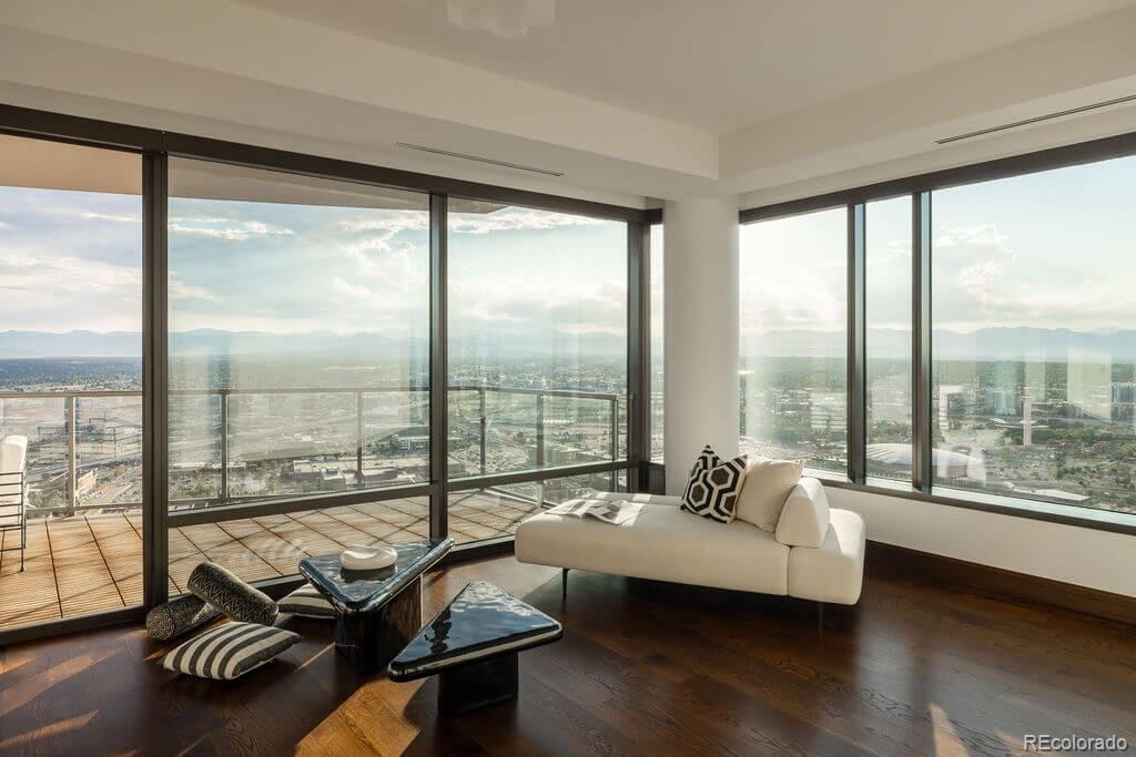 1133 14th Street, Unit 3700 Denver, CO 80202 - Photo 4 of 48 a living room with furniture and a floor to ceiling window