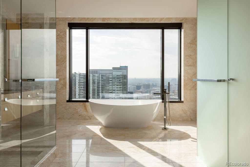 1133 14th Street, Unit 3700 Denver, CO 80202 - Photo 41 of 48 a view of a bathroom with a tub and shower