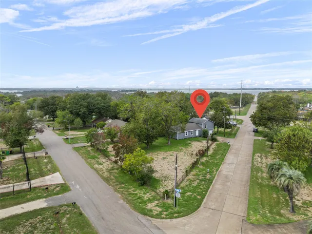 a view of a swimming pool with a yard