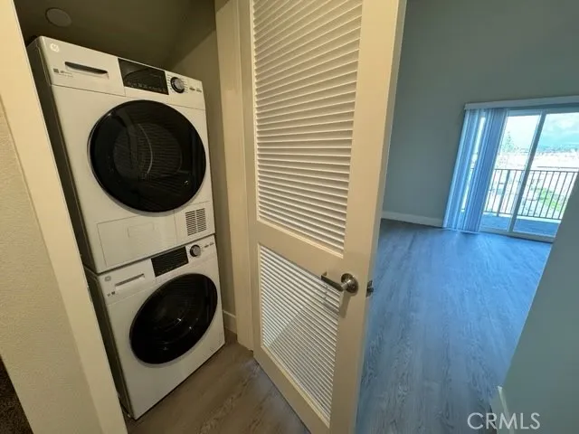 a view of a hallway with washer and dryer