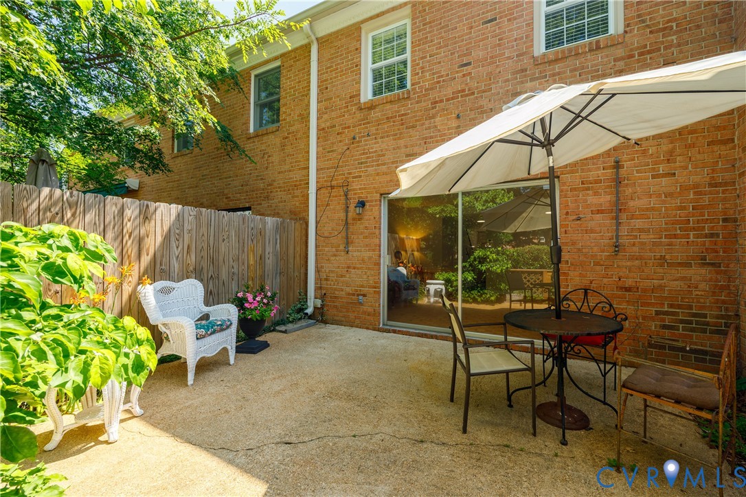 9129 Derbyshire Road, Unit E Henrico, VA 23229 - Photo 30 of 36 Private concrete patio featuring a full-height pri