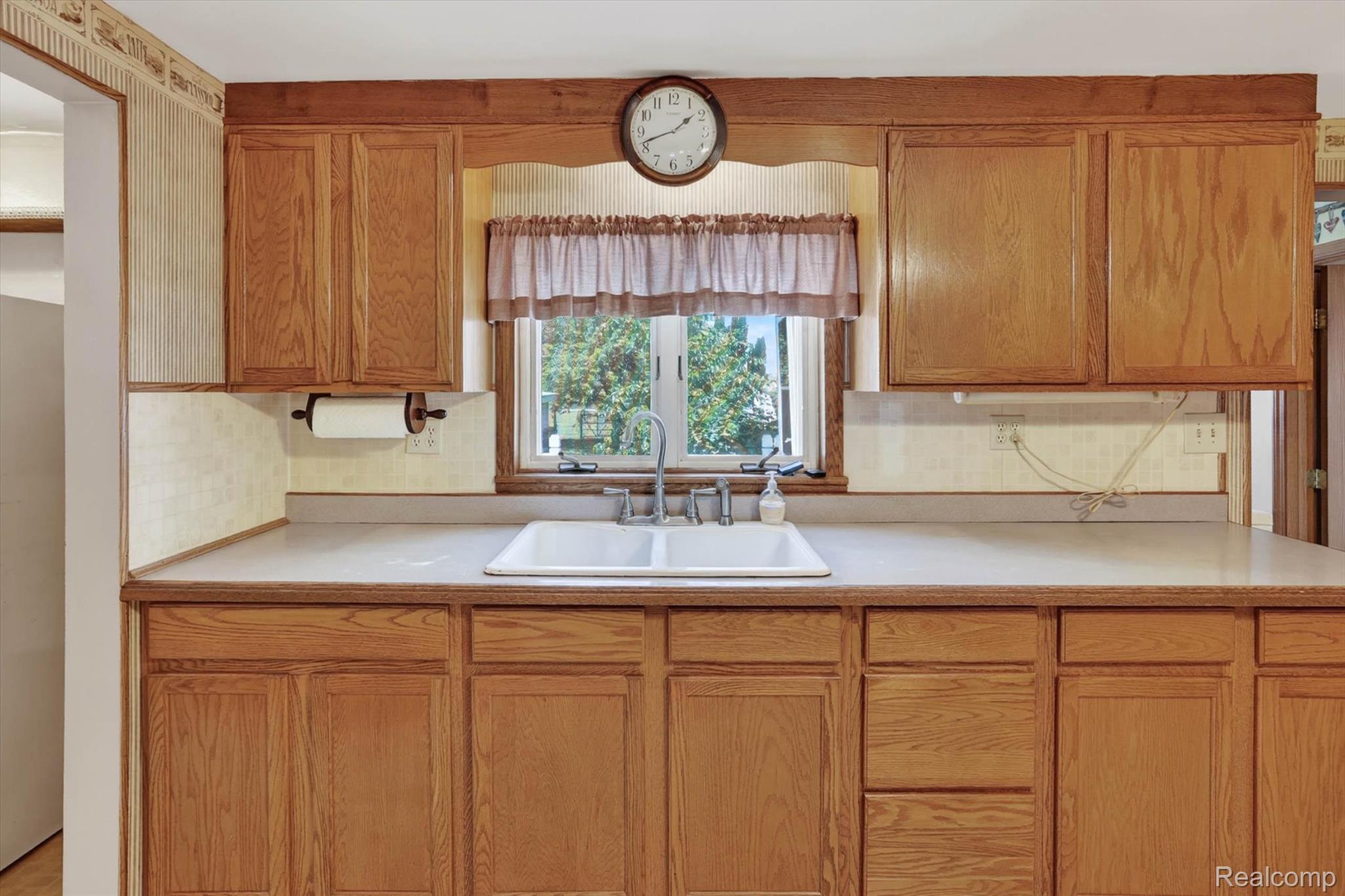 7974 West Gilford Road Reese, MI 48757 - Photo 14 of 36 Kitchen featuring light countertops and wood finish cabinetry