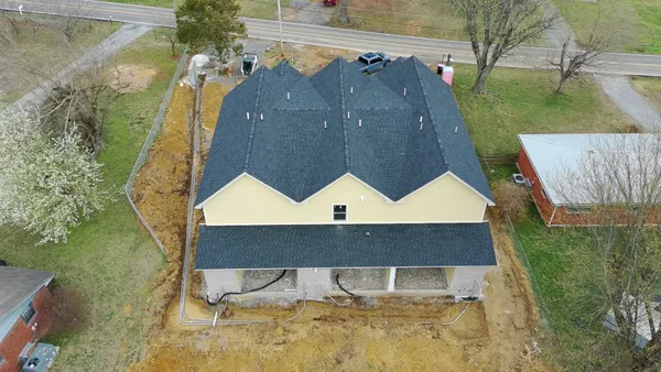 a aerial view of a house with a yard