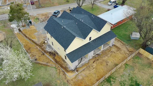 view of a house with a yard