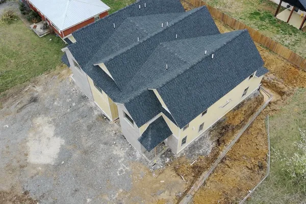 an aerial view of house with yard