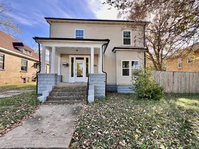 front view of a house with a yard