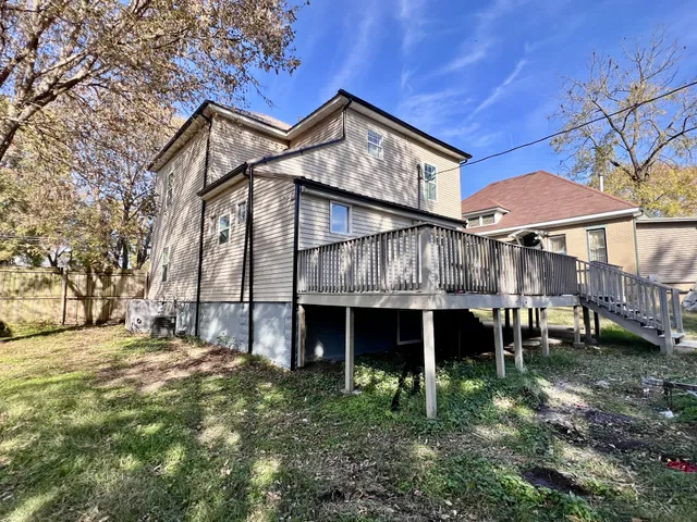 a view of house with a yard