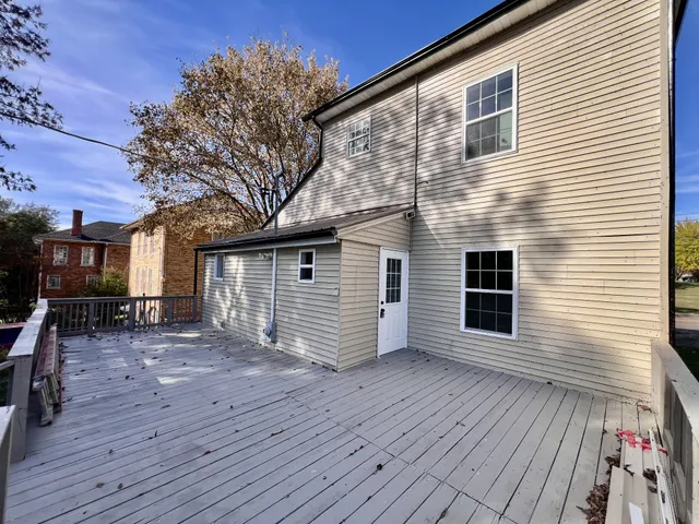 a view of a house with a yard and wooden floor