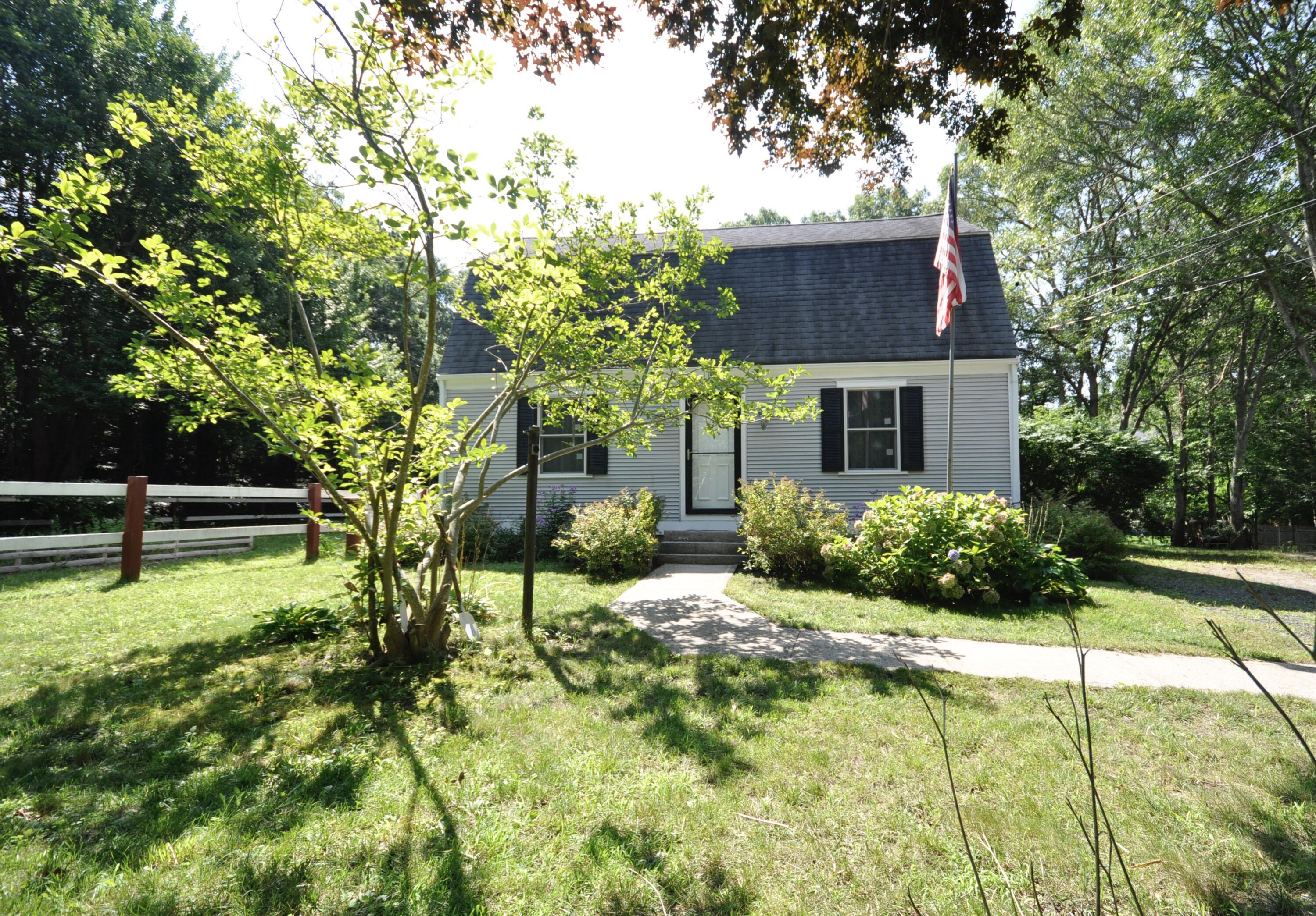 144 Clay Pond Road Buzzards Bay, MA 02532 - Photo 3 of 32 a house view with a garden space
