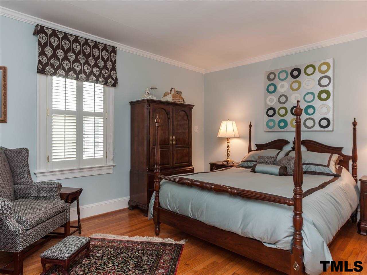 1914 Sunset Drive Raleigh, NC 27608 - Photo 14 of 25 a bedroom with a bed a couch and next to a window