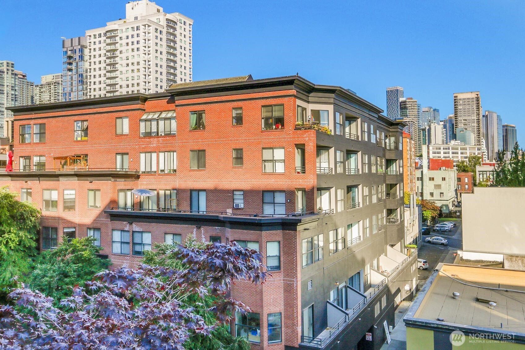 76 Cedar Street, Unit 808 Seattle, WA 98121 - Photo 17 of 20 a view of a building with a garden