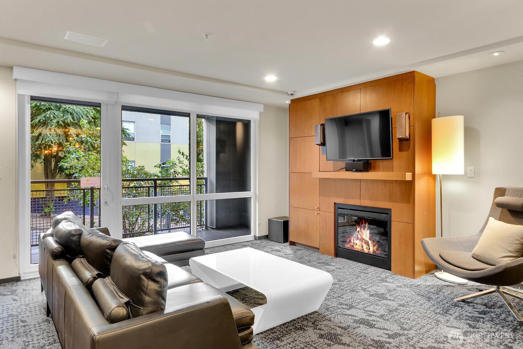 76 Cedar Street, Unit 808 Seattle, WA 98121 - Photo 3 of 20 a living room with furniture a fireplace and a flat screen tv