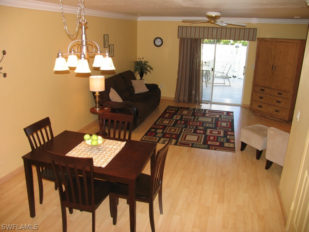 6777 Winkler Road, Unit D149 Fort Myers, FL 33919 - Photo 1 of 24 a dining room with furniture and window