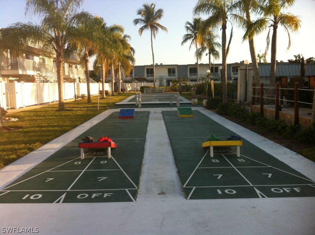 6777 Winkler Road, Unit D149 Fort Myers, FL 33919 - Photo 17 of 24 a view of swimming pool with chairs