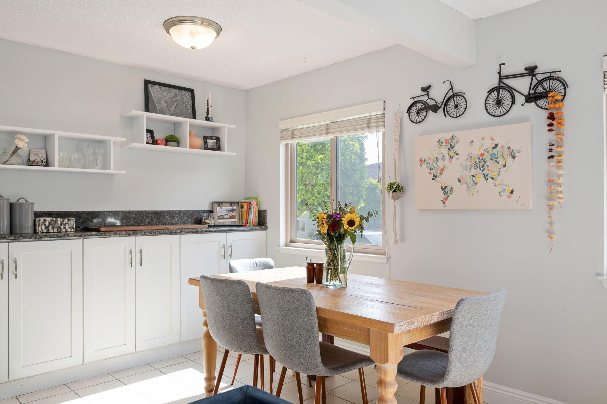 a dining room with furniture and wooden floor