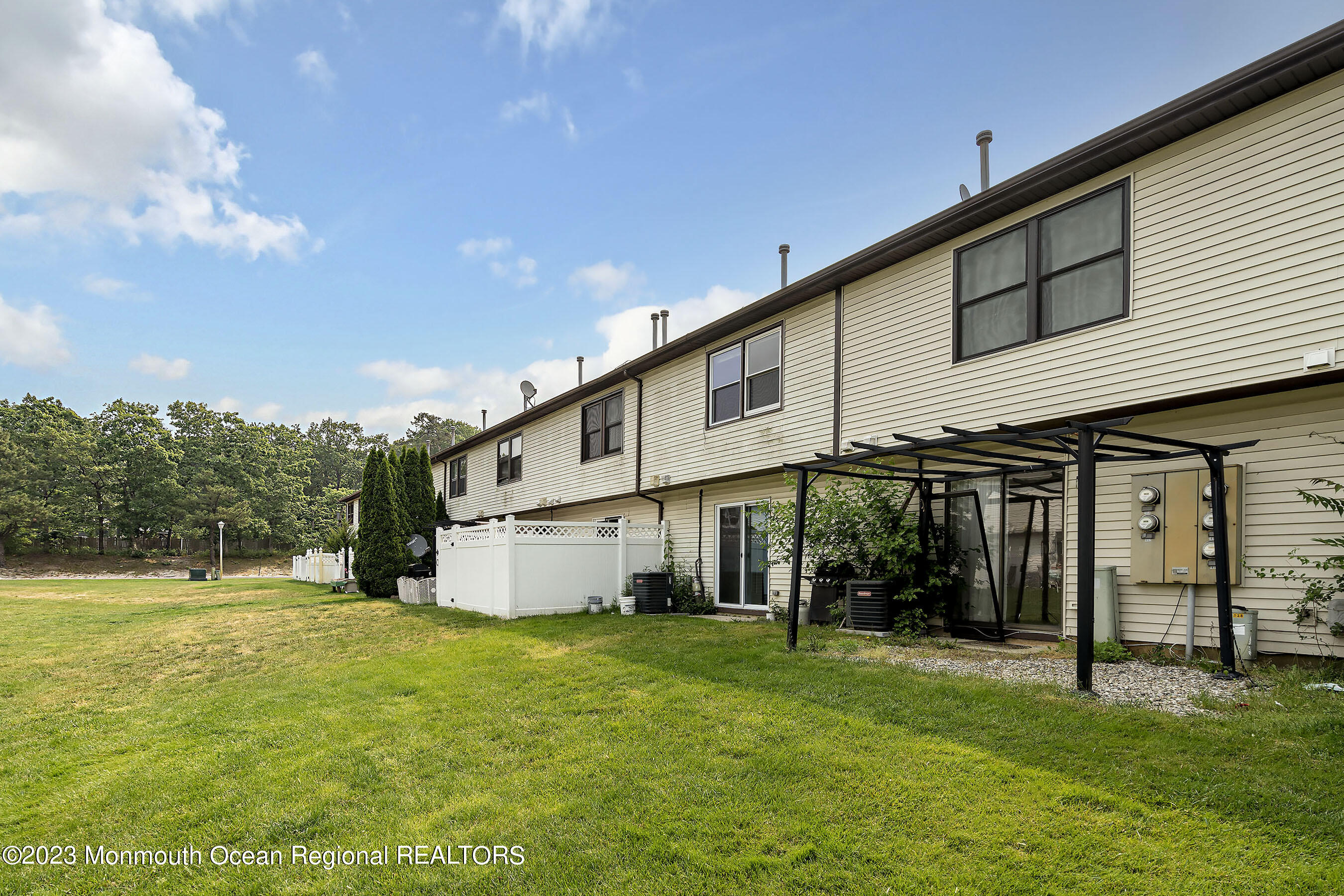1054 Sawmill Road Brick, NJ 08724 - Photo 16 of 18 a view of a house with a yard