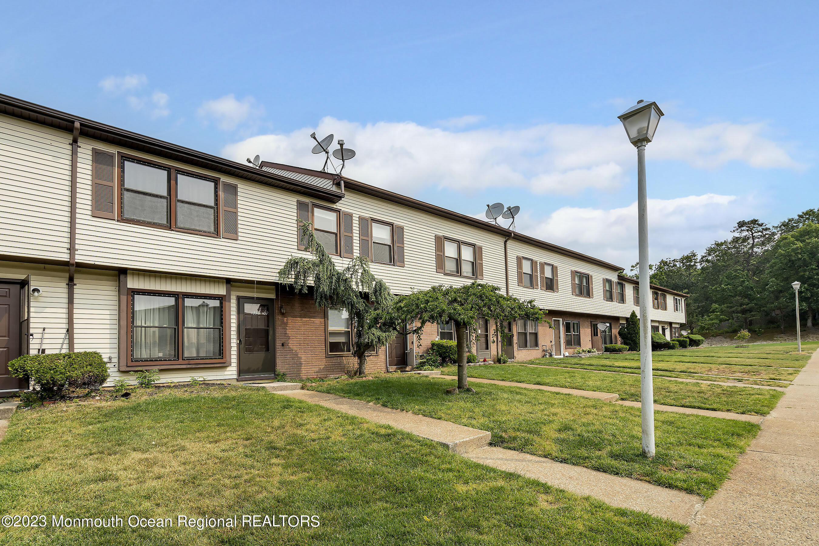 1054 Sawmill Road Brick, NJ 08724 - Photo 2 of 18 a front view of a house with a yard