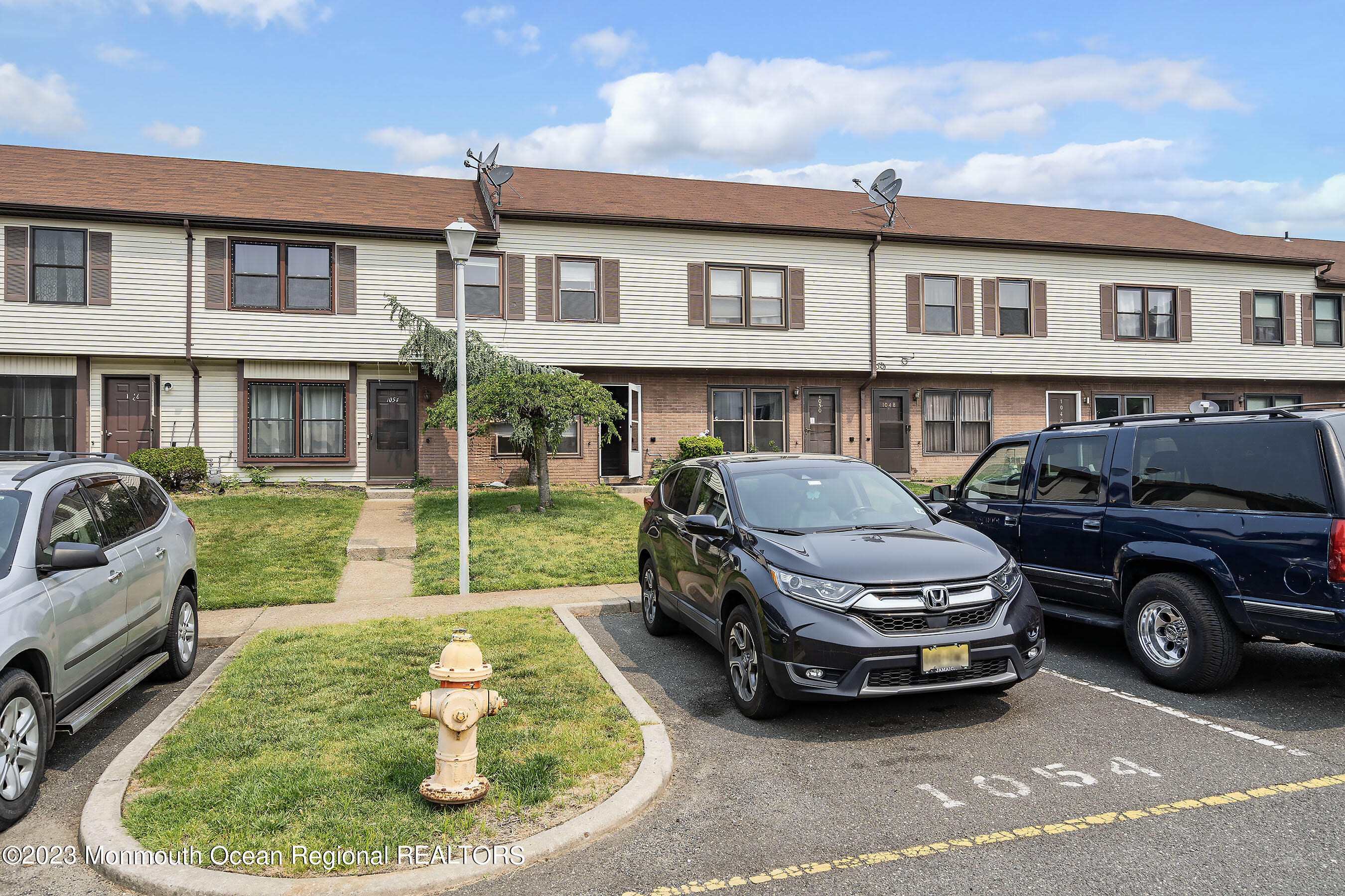 1054 Sawmill Road Brick, NJ 08724 - Photo 3 of 18 a car parked in front of a house