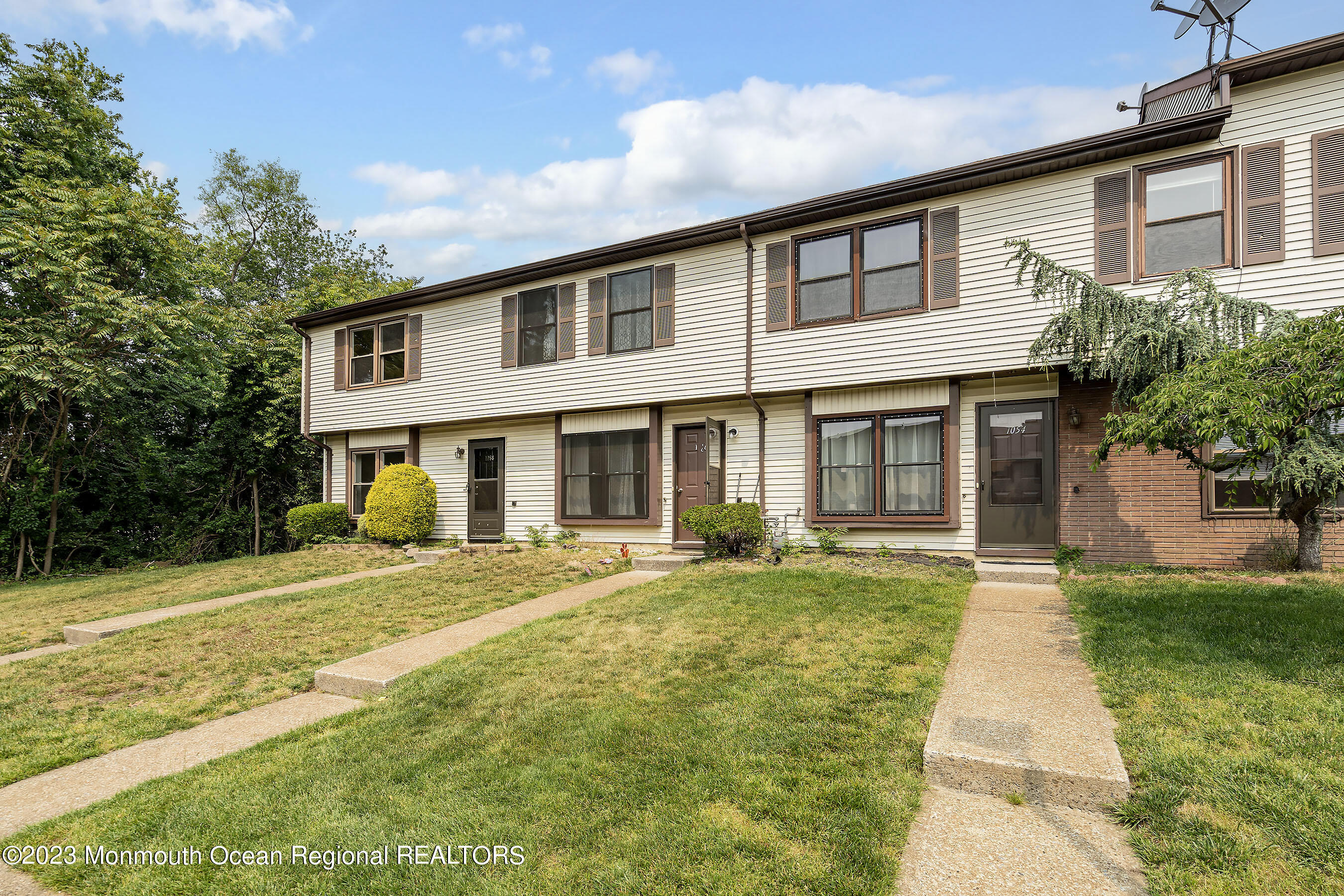 1054 Sawmill Road Brick, NJ 08724 - Photo 4 of 18 a front view of a house with a yard