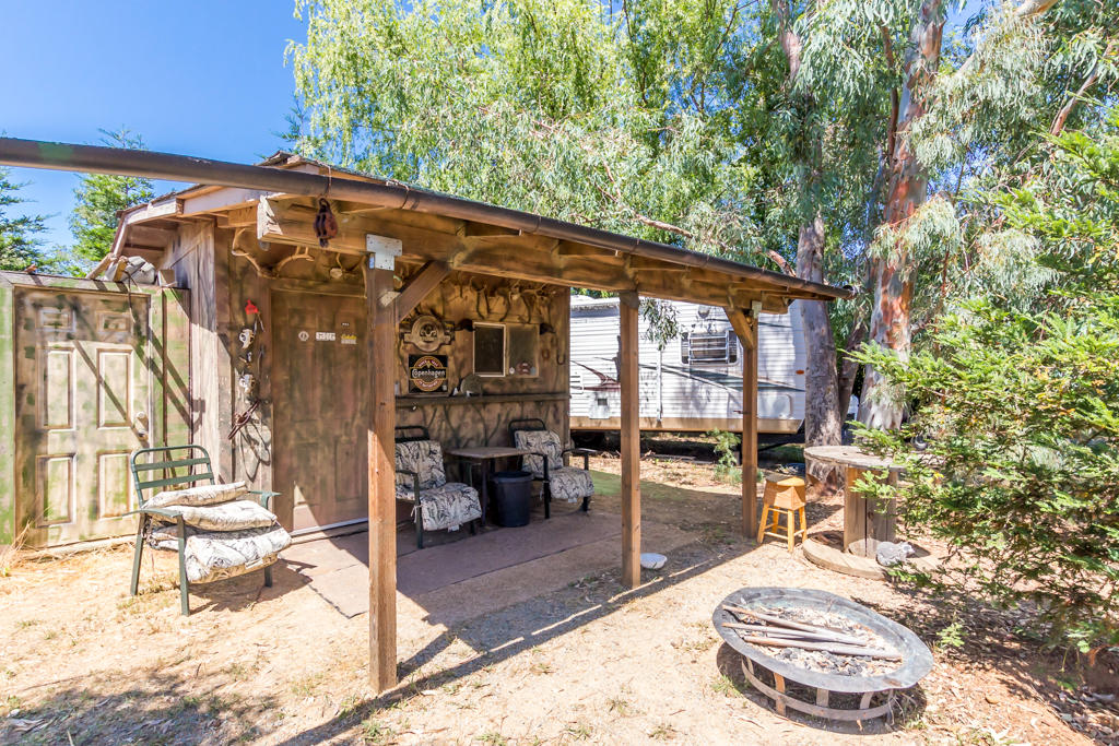 Lone Tree Road Cottonwood, CA 96022 - Photo 4 of 27 a backyard of a house with outdoor seating