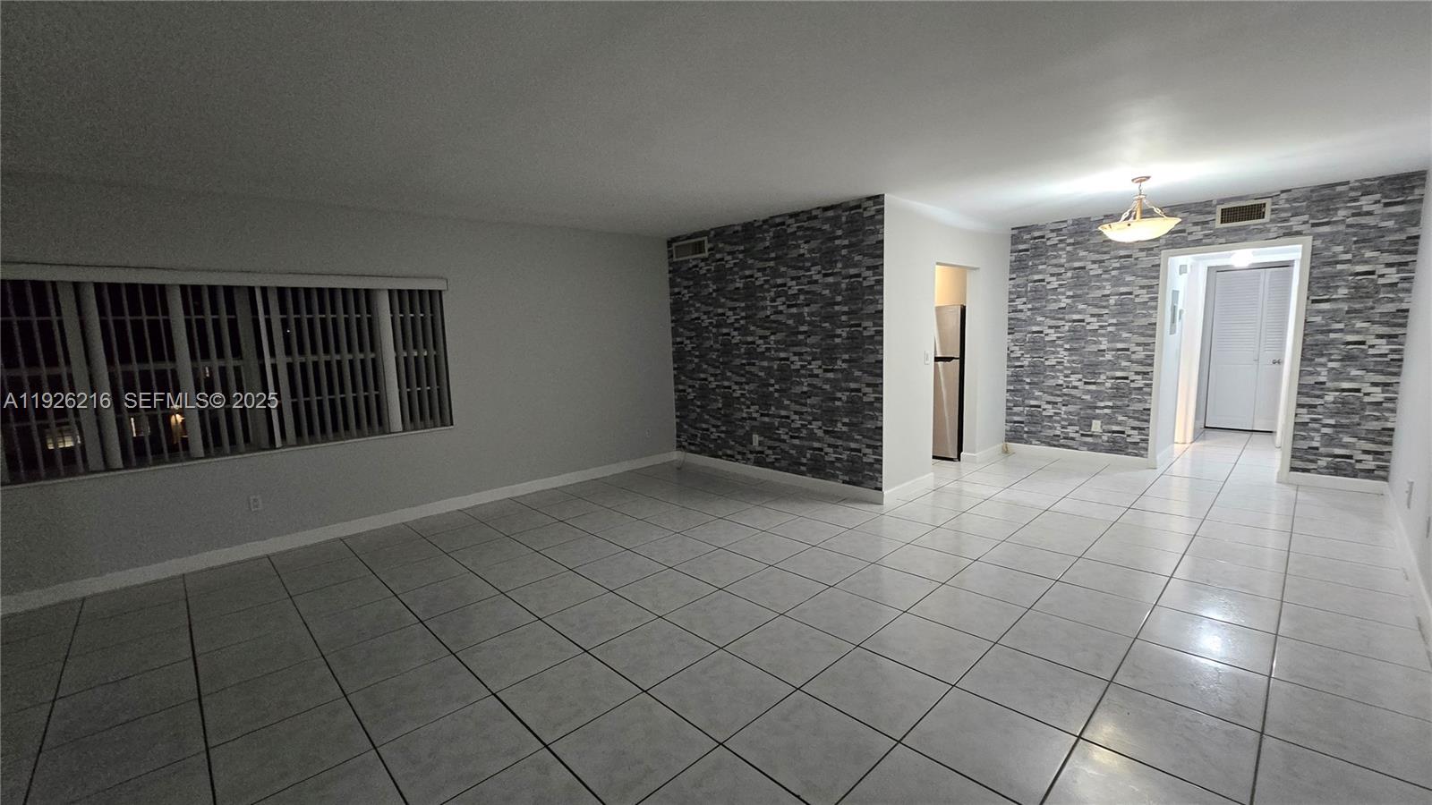 a view of an empty room with stairs