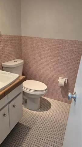 a bathroom with a toilet and a sink