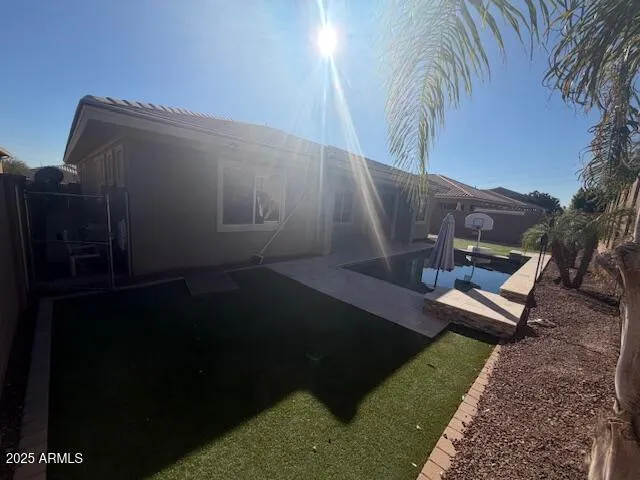 a view of a backyard with sitting area