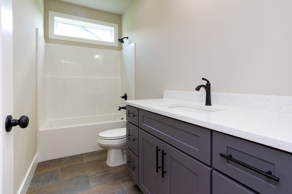 807 Oconner Smithville, TN 37166 - Photo 18 of 33 a bathroom with a sink a toilet and shower