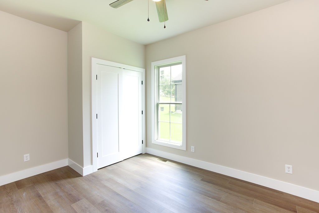 807 Oconner Smithville, TN 37166 - Photo 21 of 33 an empty room with wooden floor and windows