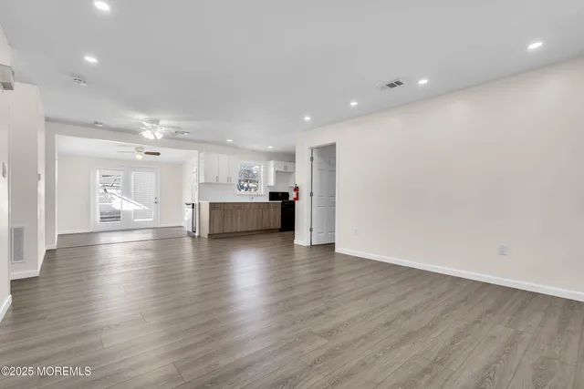 a view of a kitchen with a sink and a stove top oven