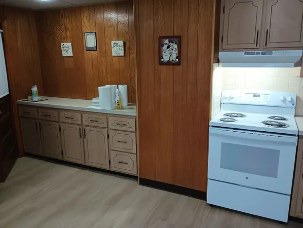 a kitchen with stainless steel appliances granite countertop a stove and a refrigerator