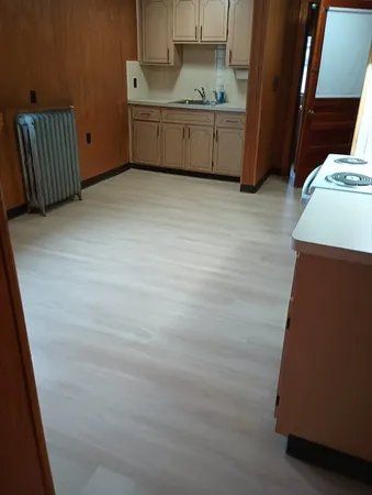 a bathroom with a sink a bathtub and a mirror