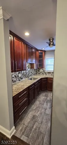 a kitchen with stainless steel appliances granite countertop a stove and a sink