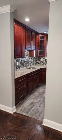 a room with a stove and a refrigerator