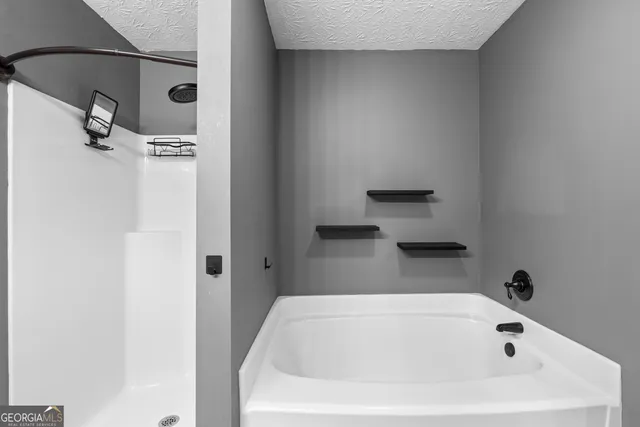 a white bath tub sitting in a bathroom