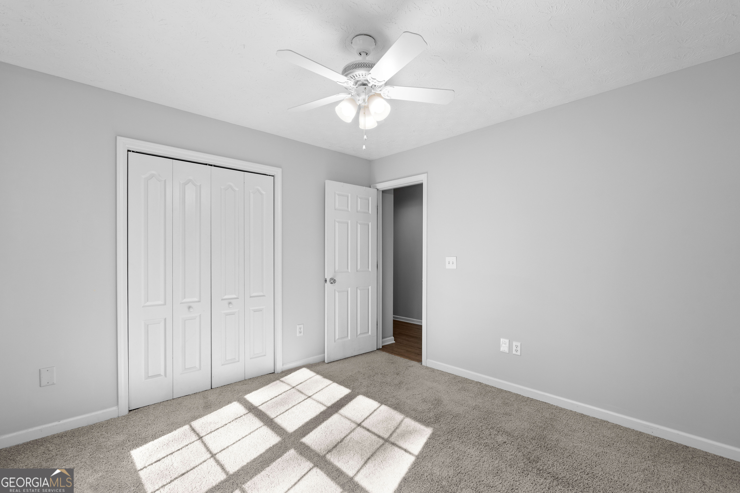 47 Matthews Street Senoia, GA 30276 - Photo 16 of 27 a view of an empty room with a window
