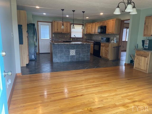 2836 Red House Road Rustburg, VA 24588 - Photo 11 of 74 a large kitchen with stainless steel appliances granite countertop a stove and cabinets