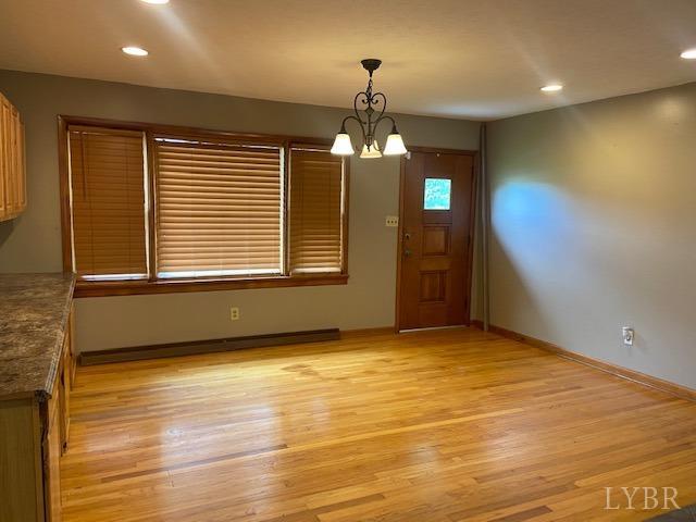 2836 Red House Road Rustburg, VA 24588 - Photo 8 of 74 a view of an empty room with window and wooden floor