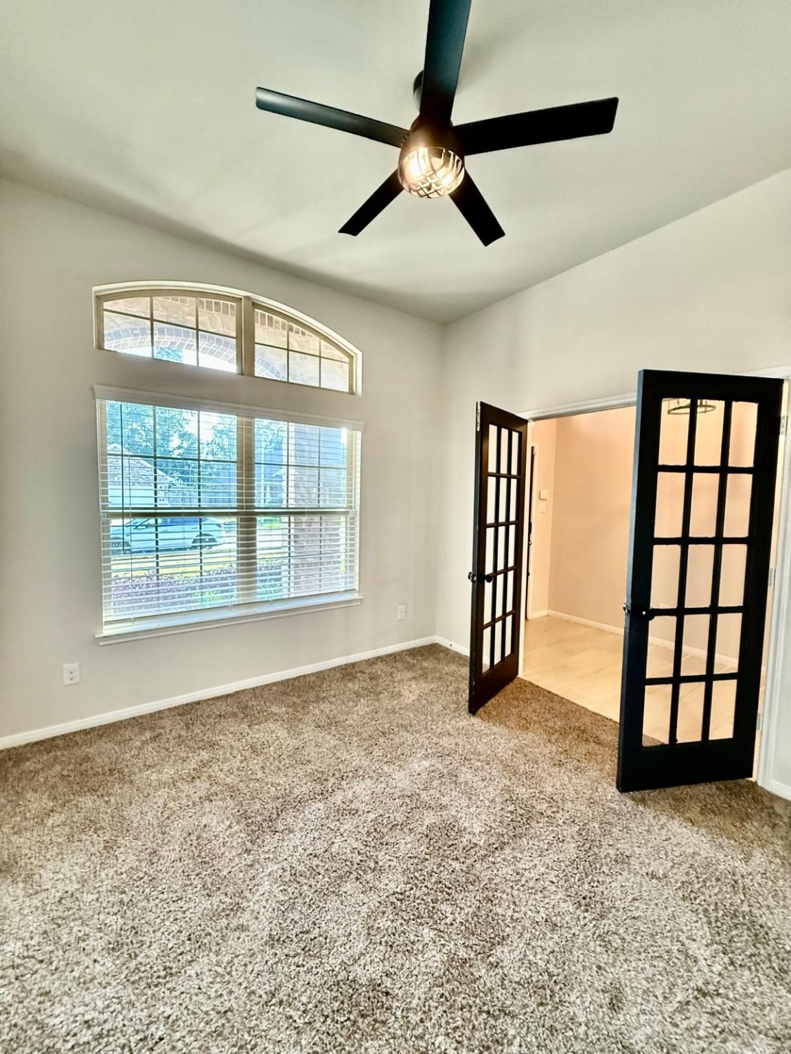 14208 Wallowa Ridge Lane Conroe, TX 77384 - Photo 14 of 48 a view of an empty room with a window