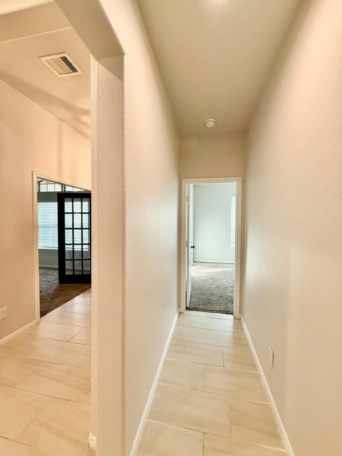 14208 Wallowa Ridge Lane Conroe, TX 77384 - Photo 18 of 48 a view of a hallway with wooden floor and entryway