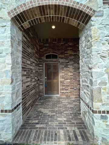 a front view of a house with parking space